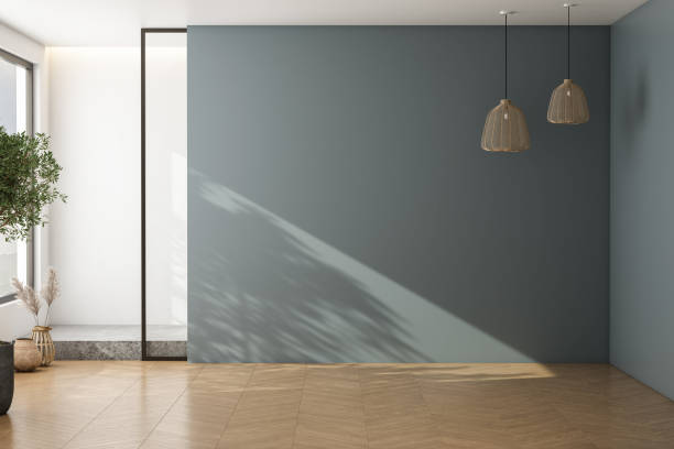 istock empty living room with blue tones wall. 1973048723