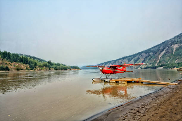 Seaplane on the Yukon River, Dawson, Canada Seaplane on the Yukon River, Dawson, Canada. High quality photo alaska gold rush stock pictures, royalty-free photos & images