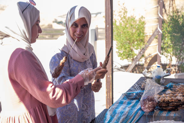 istock Female only helping each other during their vacation also with preparing barbecue 1973064608