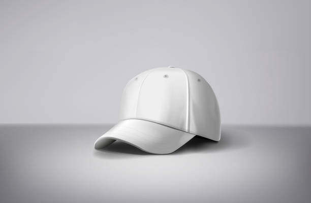 istock White baseball caps mock up a gray background. For branding and advertising. 1973068326