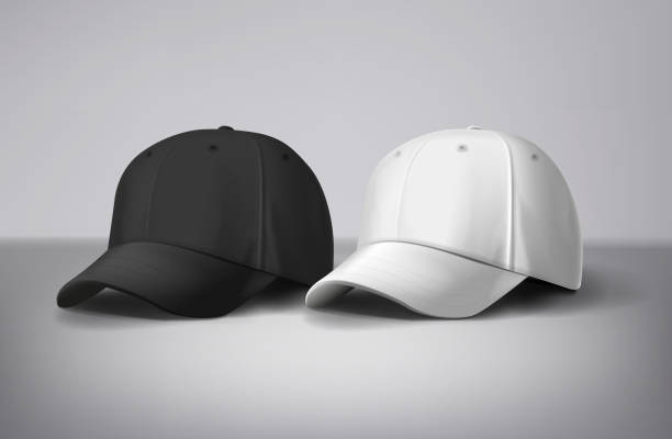 istock Black and white baseball caps mock up in gray background, front and back or different sides. For branding and advertising. 1973068412