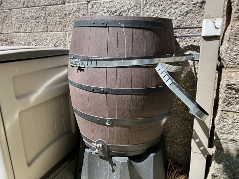 Rain barrel catching and conserving water near a rainspot, May 11, 2023