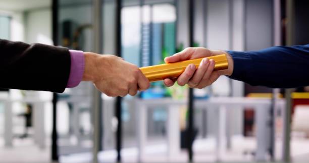 Business Man And Man Relay Baton Handover