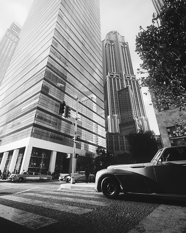 Digitally generated black-and-white image showcasing the contrast of a classic retro-futuristic car against a backdrop of modern skyscrapers in a neo-futuristic New York City, blending retro and contemporary aesthetics.\n\nThe scene was created in Autodesk® 3ds Max 2024 with V-Ray 6 and rendered with photorealistic shaders and lighting in Chaos® Vantage with some post-production added.