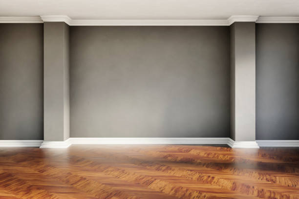 istock Empty room with gray plaster wall and wooden floor. Modern home interior background. Architecture minimal aesthetic. 1973084826