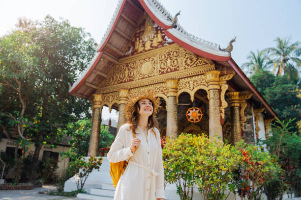 istock Woman exploring buddhist temple in Laos 1973126324