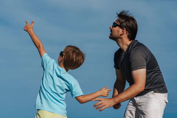 istock Boy shows his father something in the sky 1973138980