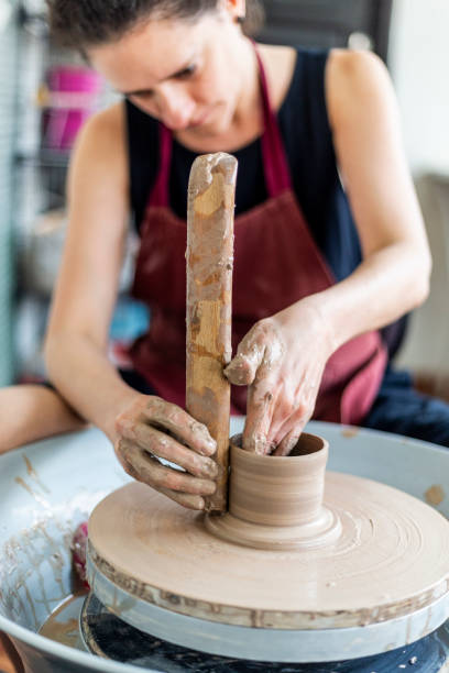 istock Caucasian woman molding ceramics with her hands 1973146617
