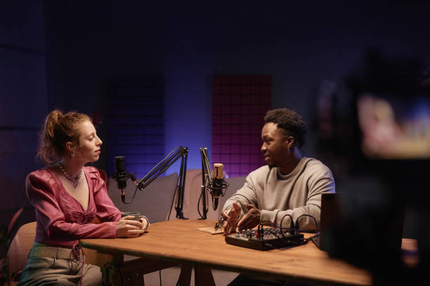 istock Young Girl and Man Recording Interview in Studio 1973173811