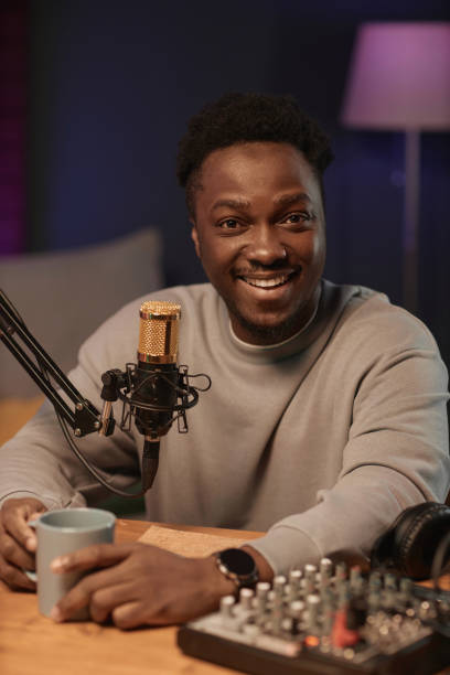 Cheerful Male Podcaster Looking at Camera