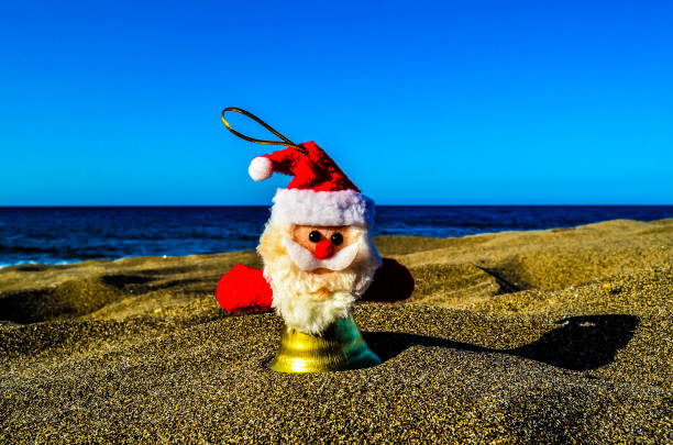 A vibrant Santa figure rests with a book and mug, with a glowing Christmas tree adding warmth and festive charm.