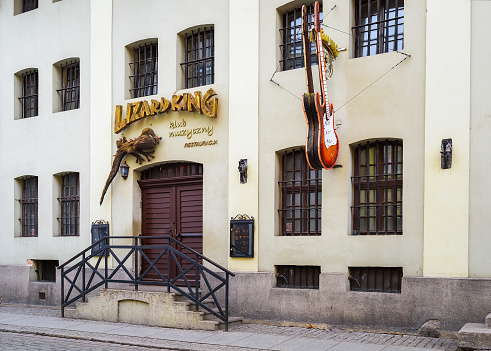 Torun, Poland - July 21, 2023: The facade of a restaurant in Toru. Music club. Historic facades at the famous of Torun mediaeval town.