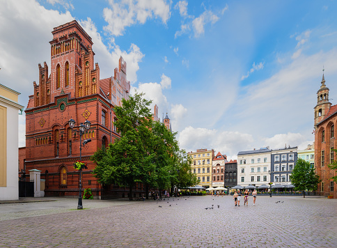 Torun, Poland - July 21, 2023: The building of the main post office was built in the 80s of the 19th century. Traditional architecture in famous polish city, Torun, Poland.