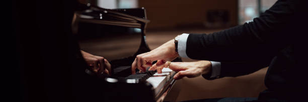 istock Hands in elegant suit playing pisano 1973297684