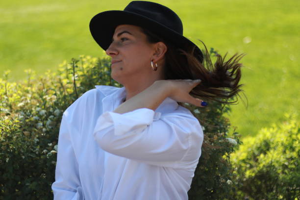 istock Beautiful  elegant young woman with hat 1973359179