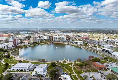 Drone angle view of Lakeland, Florida with Mirror Lake and city skyline.