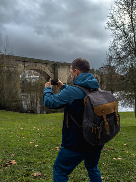 istock Capturing Moments: Solo Traveler at the Riverside 1973372499