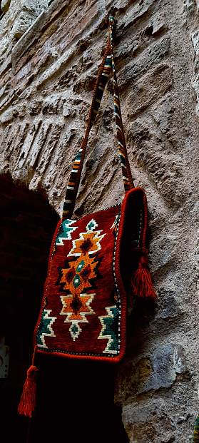 A saddlebag hanging on the wall in an old inn in Bolu, Türkiye