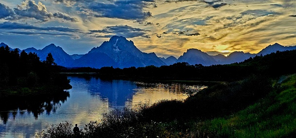 Stunning sunset of the beautiful Grand Tetons in Wyoming in summer along the Snake River