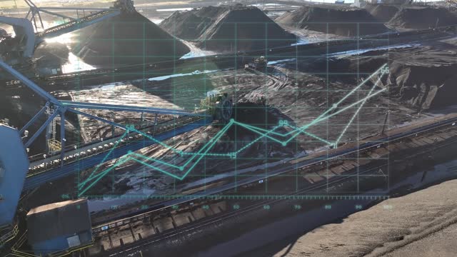 Coal mining operations with overlay of industrial monitoring graphics. Bucket wheel excavator and heavy machinery aerial shot with special effects graphs representing production and efficiency.