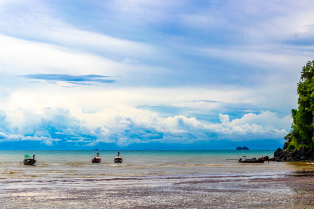 istock Tropical paradise turquoise water beach longtail boat Krabi Thailand. 1973407639