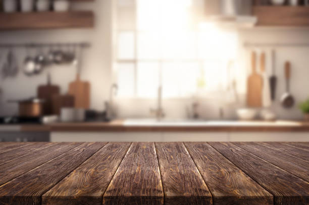 istock Wooden table or surface on the background of a beautiful kitchen 1973424940
