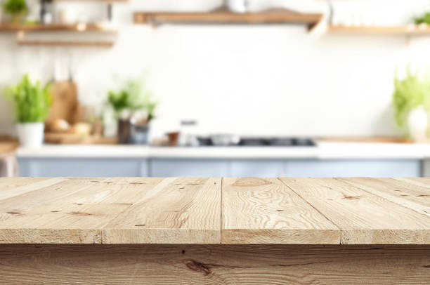 istock Wooden table or surface on the background of a beautiful kitchen 1973425977