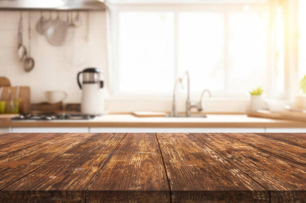 istock Wooden table or surface on the background of a beautiful kitchen 1973428566