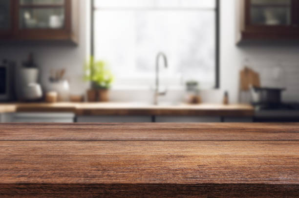istock Wooden table or surface on the background of a beautiful kitchen 1973430629
