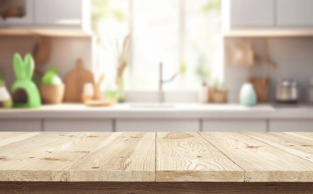 istock Wooden table or surface on the background of a beautiful kitchen 1973433259