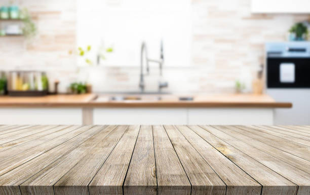 istock Wooden table or surface on the background of a beautiful kitchen 1973434290
