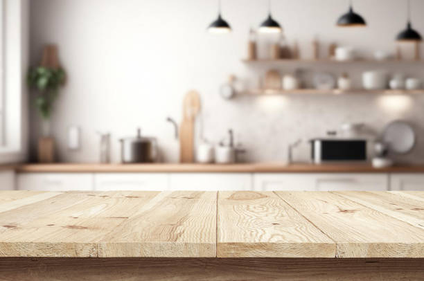 istock Wooden table or surface on the background of a beautiful kitchen 1973435336