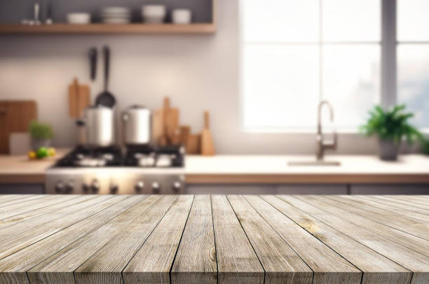 istock Wooden table or surface on the background of a beautiful kitchen 1973436906