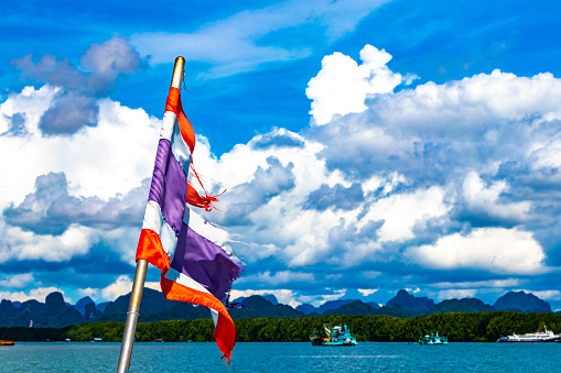 Thailand Thai flag on boat on tour in Ao Nang Amphoe Mueang Krabi Thailand in Southeast Asia.