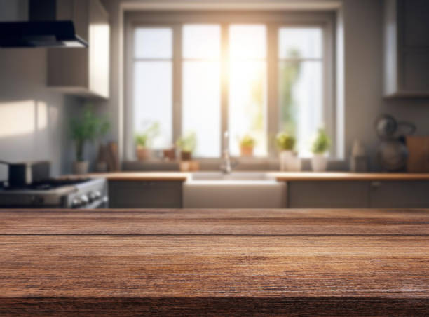 istock Wooden table or surface on the background of a beautiful kitchen 1973438470