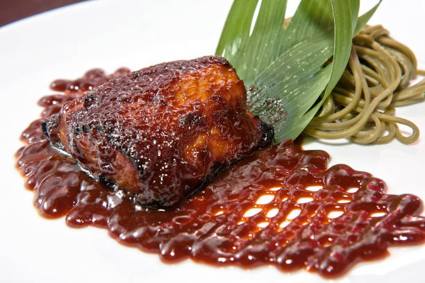 istock Plate of black cod with chipotle miso and whole meal pasta 1973438979