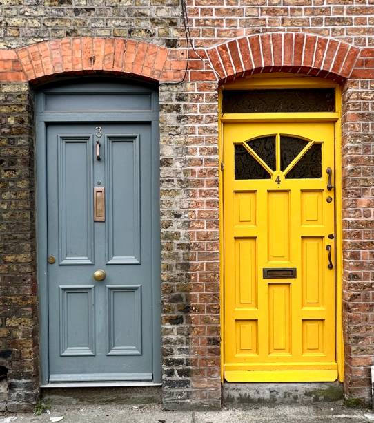 istock Traditional wooden doors on a brick wall 1973440006