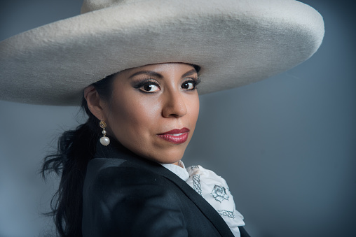Latina Mexican Woman Dressed in Charro Costume, Sombrero Bench in Study Session
