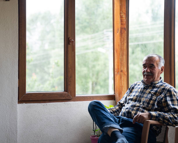 istock Candid 4K video of senior man using smartphone 1973449839
