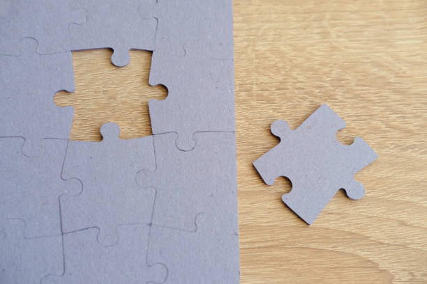 istock cardboard puzzle pieces, logical skills, puzzle solving and memory improvement, business concept for completing, memory improvement 1973473045