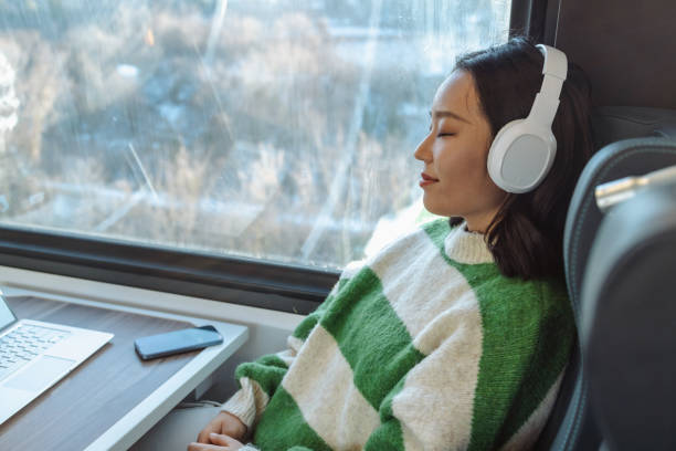 asian female traveler sleeping in train - high speed train audio zdjęcia i obrazy z banku zdjęć