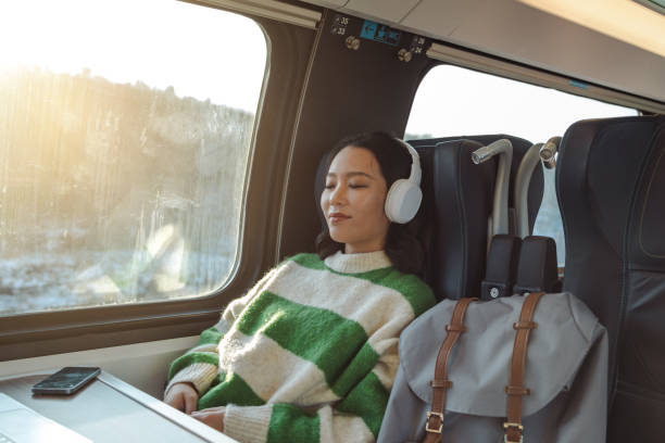 asian female traveler sleeping in train - high speed train audio zdjęcia i obrazy z banku zdjęć