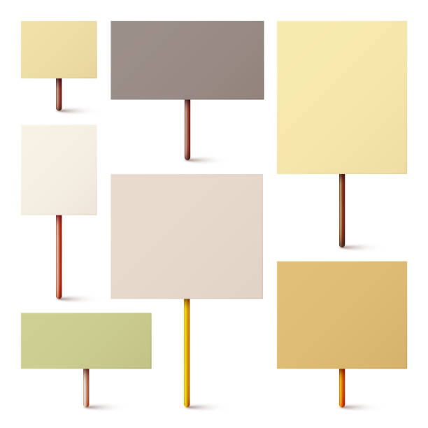 istock Blank colorful protest sign with wooden holder. Realistic vector demonstration banner. Strike action cardboard placard mockup 1973501252