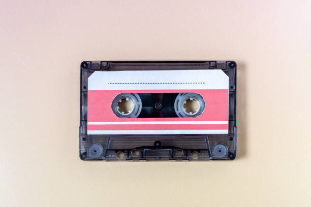 istock Top view of a music cassette on a yellow background. 1973508670