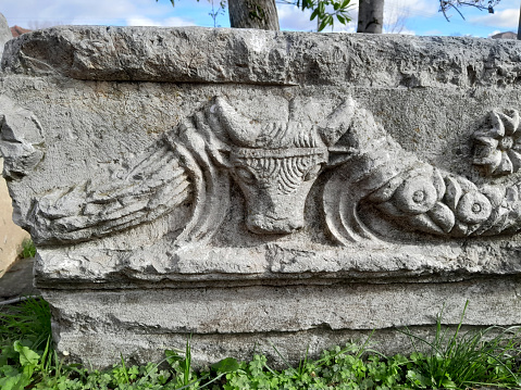 Bull relief on column head in Prusias ad Hypium, Konuralp, Duzce, Turkey.