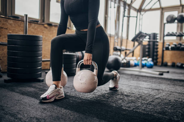 istock Woman exercising with kettlebells 1973550141