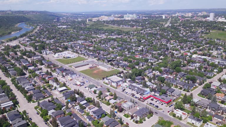 The neighbourhoods of Hillhurst, Upper Hillhurst, Kensington and Westmount in the City of Calgary are flown overhead by an aerial drone.