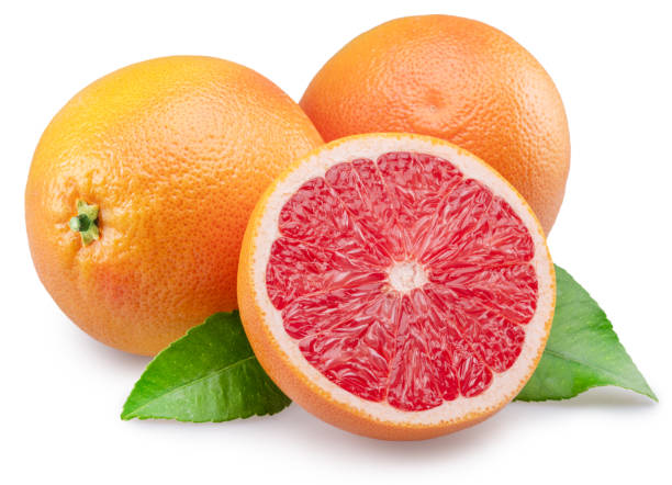 istock Red grapefruits and grapefruit cross section on white background. File contains clipping path. 1973676942