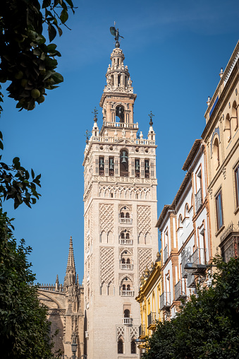 The Giralda is the bell tower of the Cathedral of Seville in Seville, Spain, one of the largest churches in the world and an outstanding example of the Gothic and Baroque architectural styles