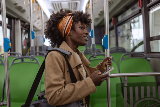 istock Young woman driving by public transport 1973682123